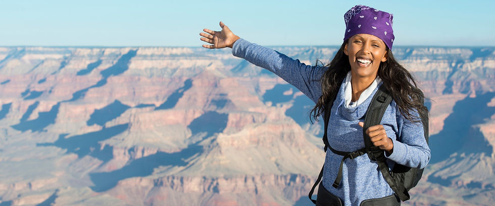 Smiling hiker with a backpack at the Grand Canyon