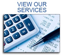 Calculator and pen on financial documents with View Our Services text