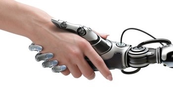 Human and robotic hands shaking for wealth management.