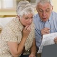 Senior couple reviewing financial documents together