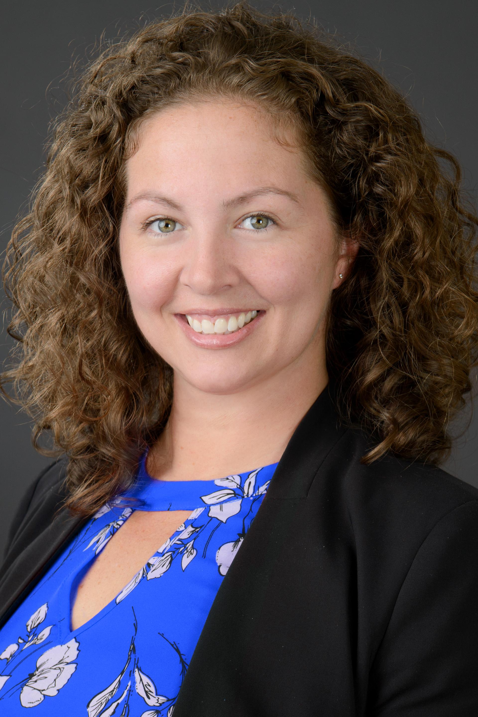 Professional headshot of Carly Foust smiling.