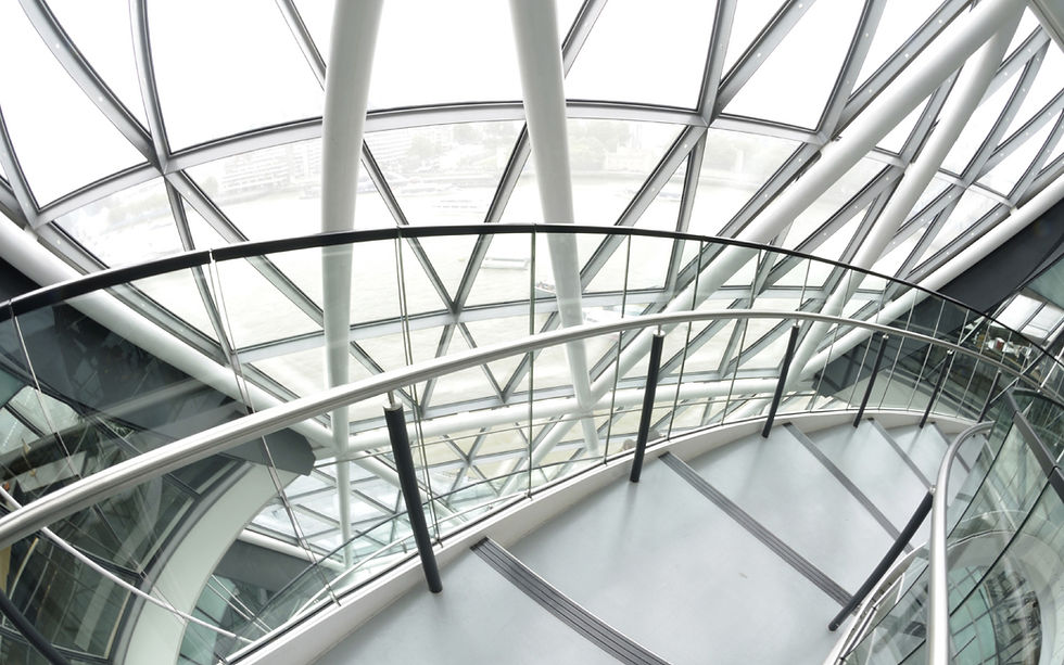 Modern spiral staircase under a geometric glass dome