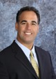 Portrait of a smiling associate in a suit