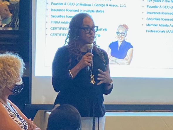 Melissa L. George speaking at a financial seminar
