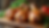 Close-up view of fresh chicken drumsticks on a wooden cutting board