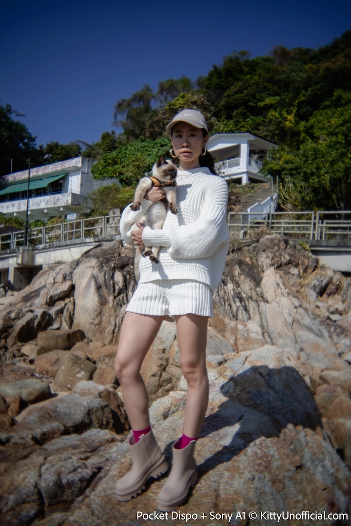 Kitty Unofficial holding her cat at the beach
