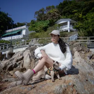 Kitty Unofficial with her cat sat on a rock