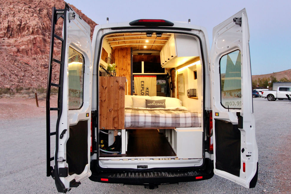 A rugged camper van ready for adventure amidst Utah’s striking sandstone formations.