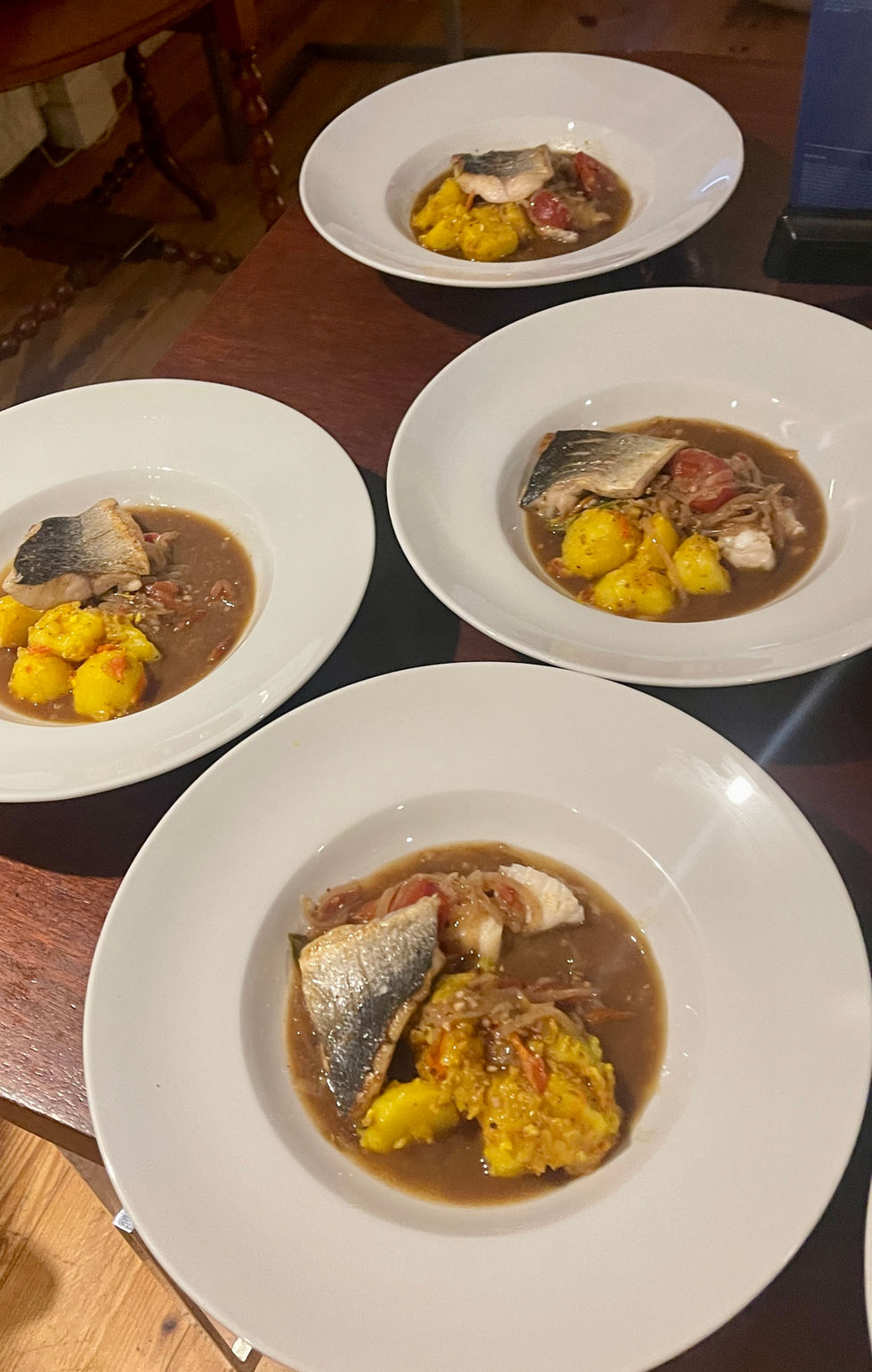 sea bass and turmeric potatoes in Rasam broth london restaurant hotel