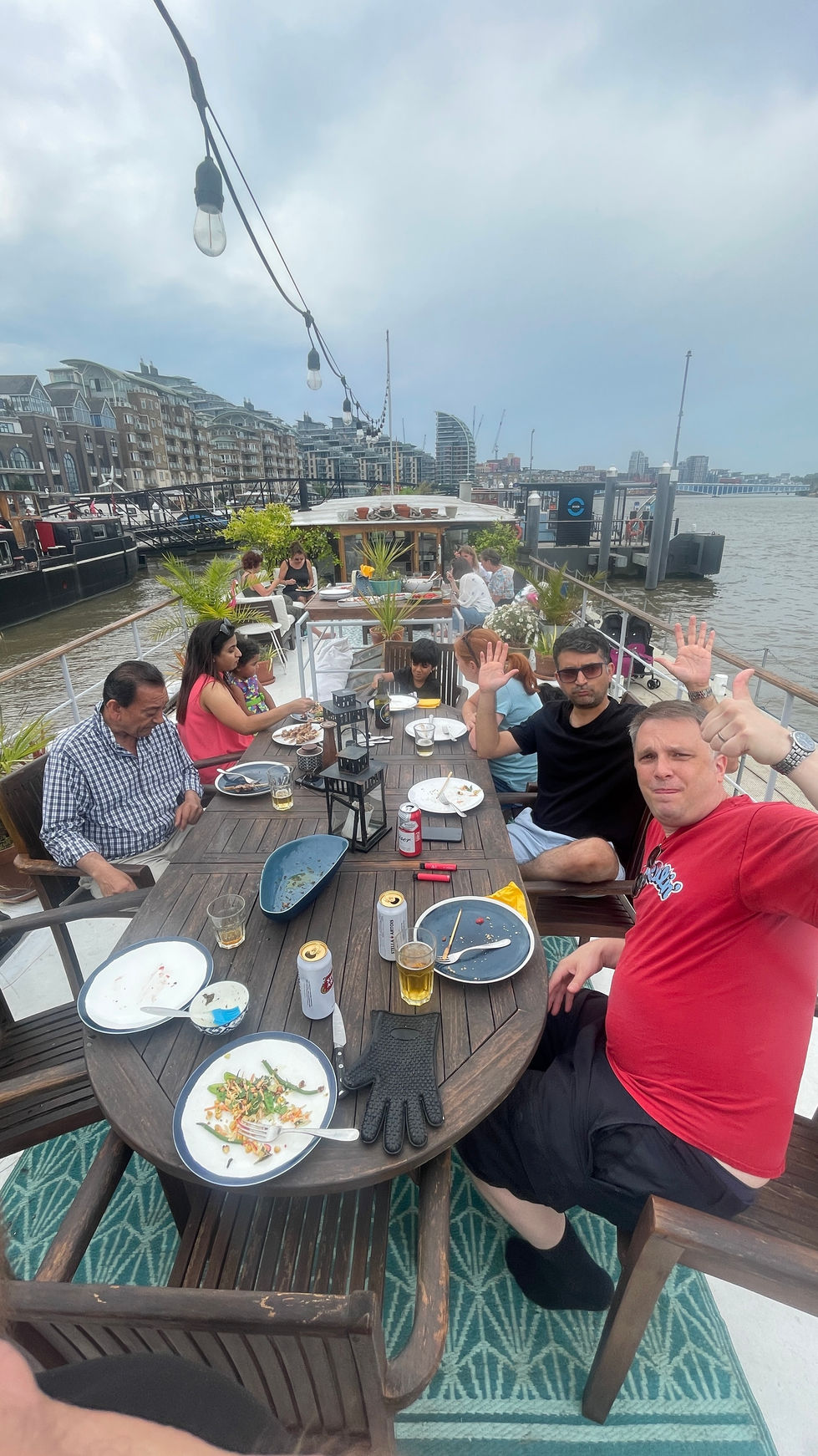 Team day out barbecue on the deck of the barge london restaurant hotel