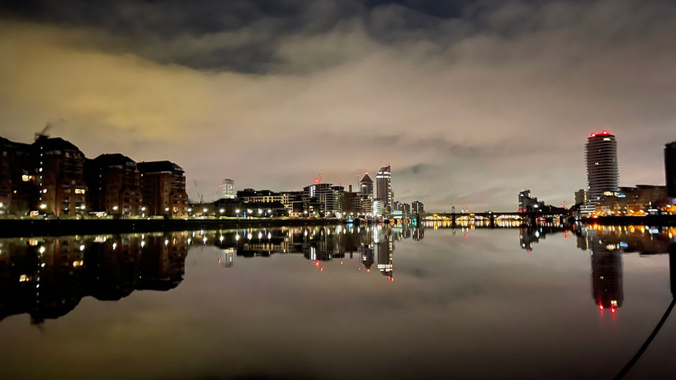a great reflection on the River Thames looking East towards London Battersea hotel