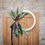 Thumbnail: Yarn inspired hoop door hanger with beautiful greenery and a bow