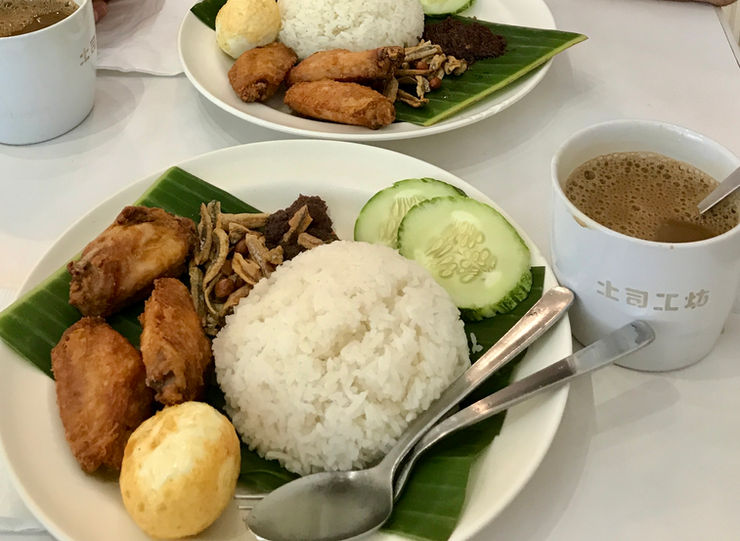 Nasi Lemak Dish with Kopi for Breakfast at a Hawker Center. Singapore.
