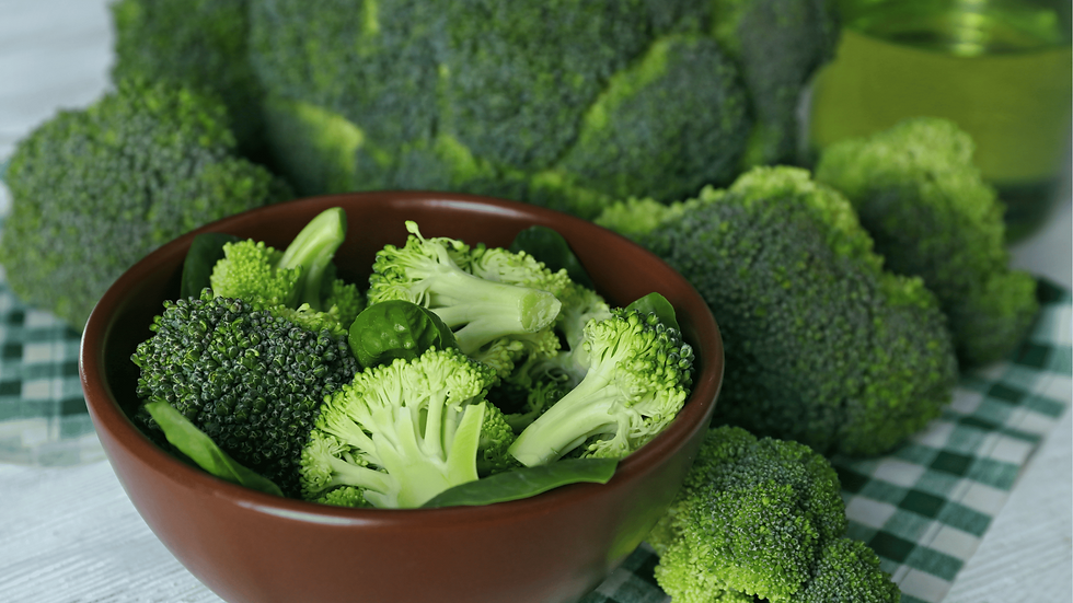 Broccoli and spinach in a bowl.