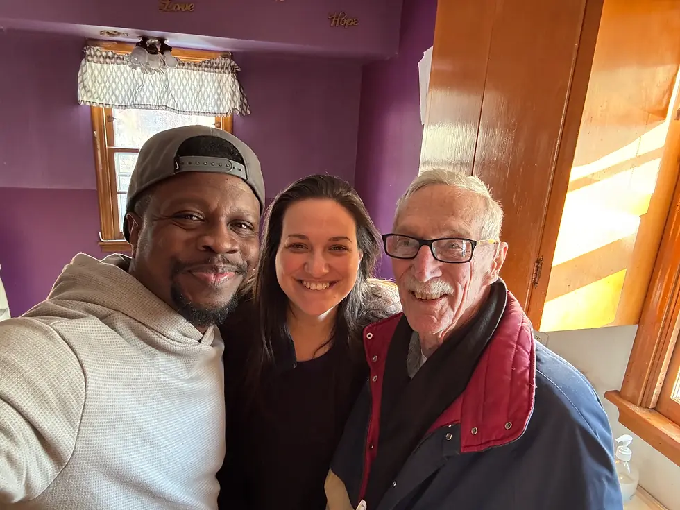 Happy homeowners and real estate professionals in a Minneapolis, Minnesota home, celebrating a successful property solution.