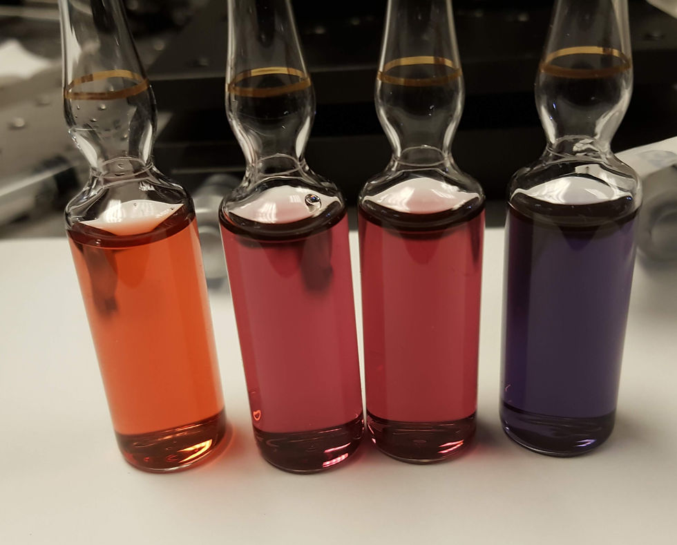 Vials containing solutions of gold nanoparticles of different sizes