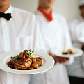 Waitstaff Holding Plates