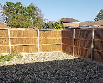featheredge fencing fitted using concrete posts and gravel boards