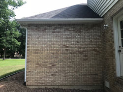 Before staining brick on the side of a house