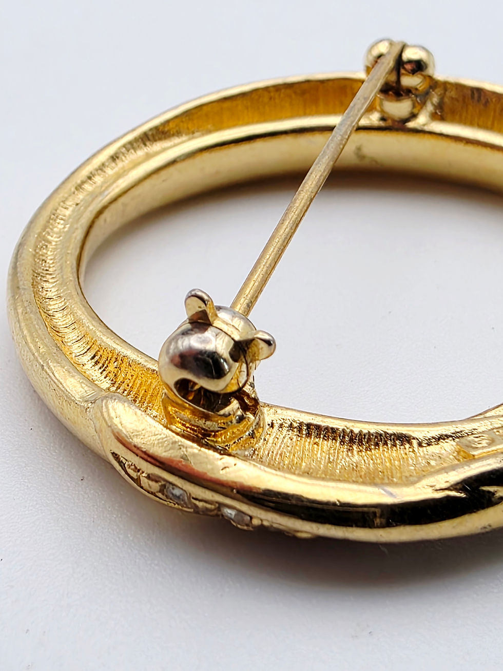 Thumbnail: Close up view of the rollover safety clasp attachment on the reverse side.