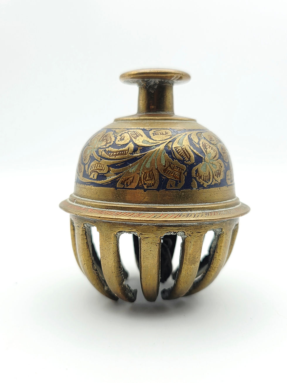 Full view of a mid-century Indian brass elephant claw bell with blue enamel floral engraving.