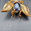 Thumbnail: Mid Century Insect Brooch Gold Tone with Blue and Red Glass Stones