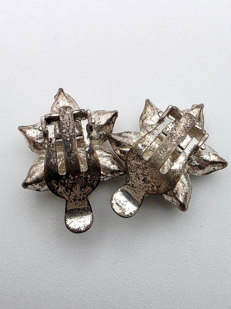 Thumbnail: reverse side showing silver tone backings and paddle clip fastenings