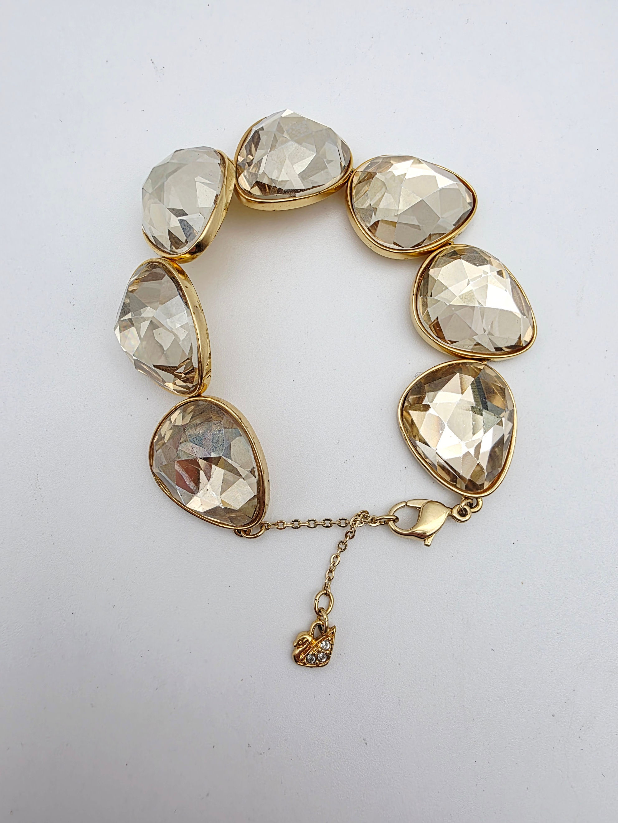 Authentic Swarovski Golden Shadow crystal link statement bracelet with swan charm.