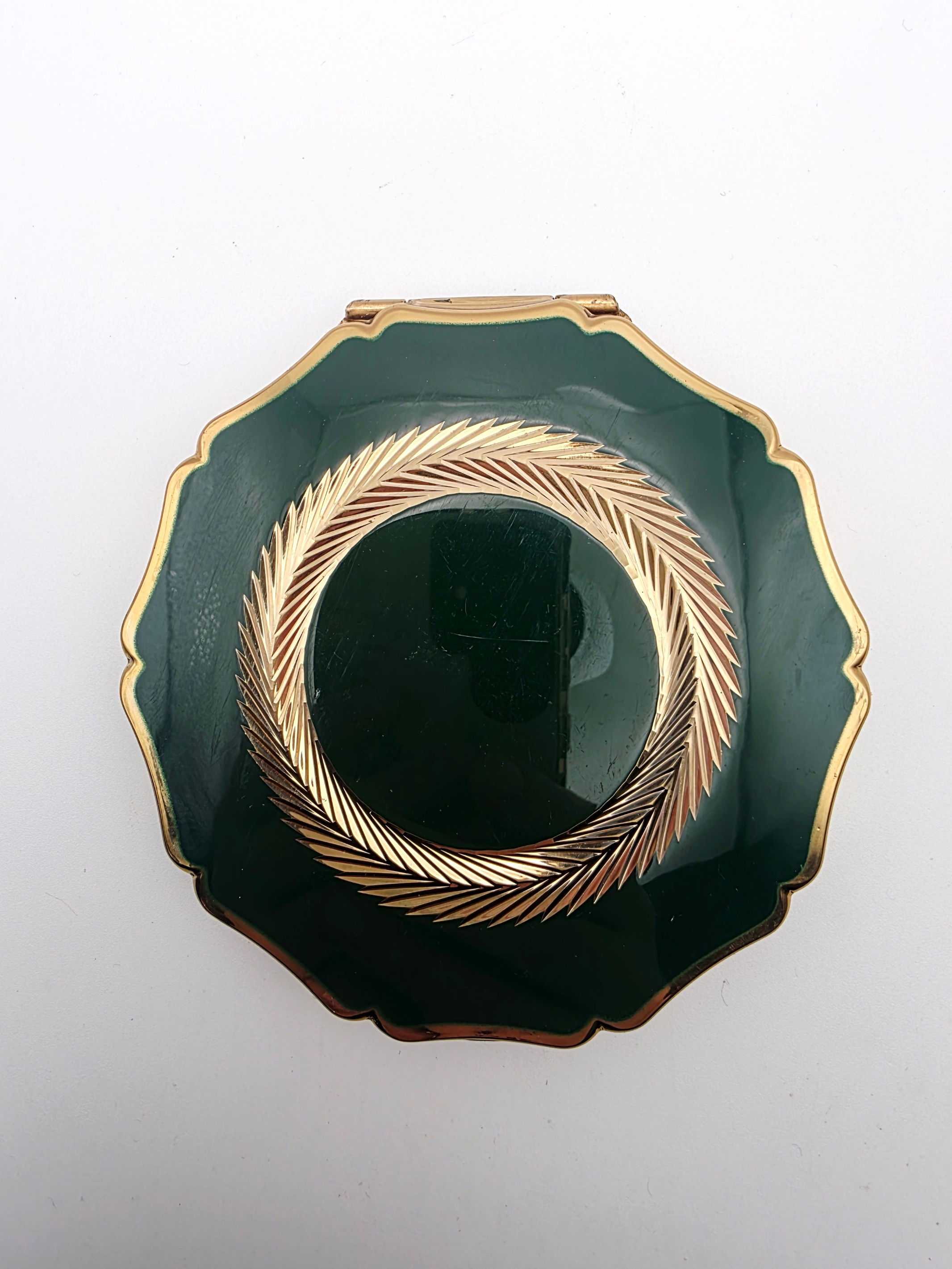 Mid-century Stratton compact with dark green enamel and gold laurel wreath
