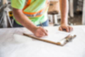 Worker signing forms.jpeg