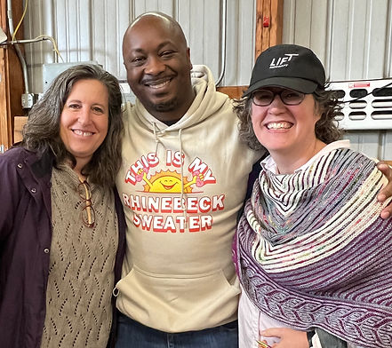 Picture of two women with man in between