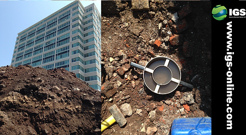 Double ring infiltrometer setup in an urban geotechnical testing site near a construction project.