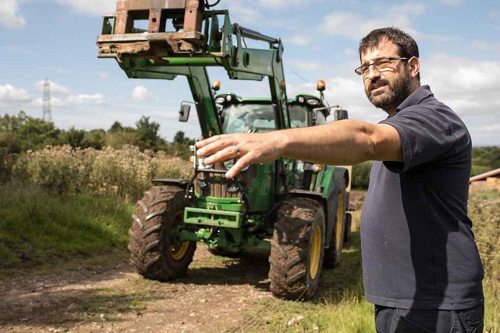 Bristol commercial photography - man standing in front of tractor