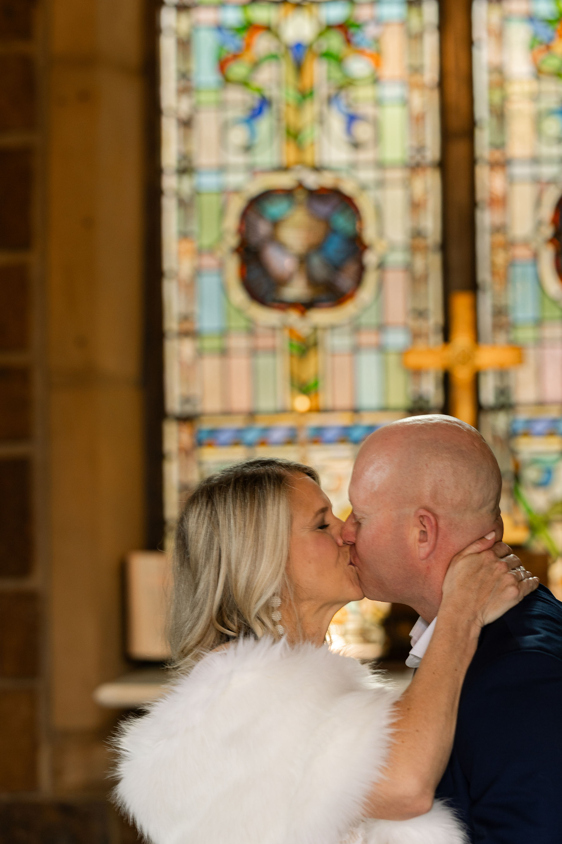 Close-up of couple kissing in chapel