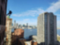 RDS window cleaner hanging off a building in Manhattan