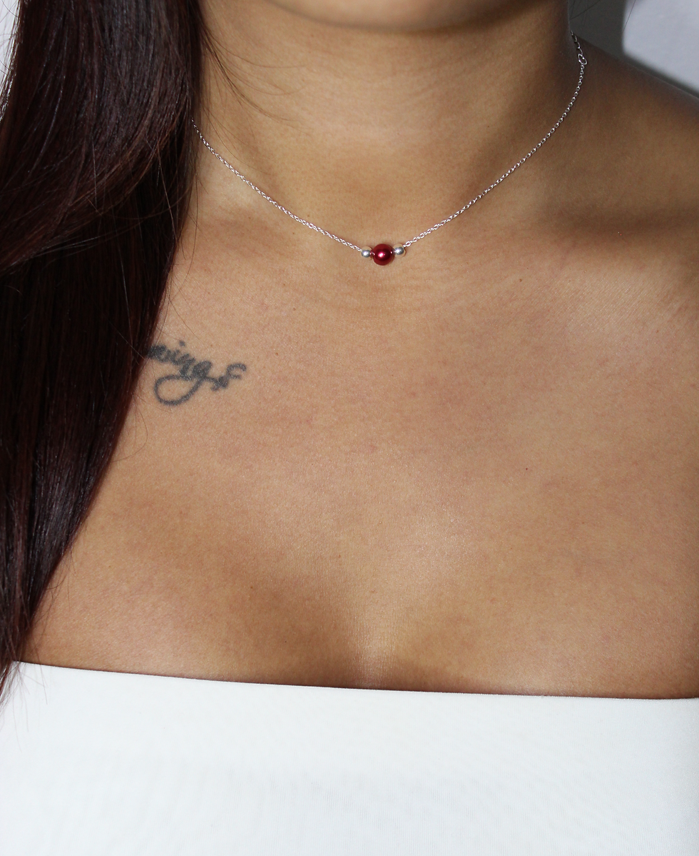 925 sterling silver choker with christmas red bead and two silver ball detail.