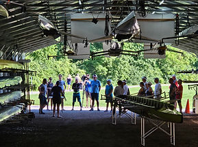 Group of adult rowers getting coached before heading onto the water