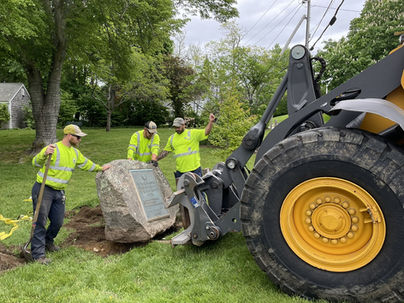 In spring 2025, a crew from the Sandwich Department of Public Works moved the 1976 Bicentennial Boulder from what is now private property by the Deacon Eldred House to a more accessible spot in Mill Creek Park in preparation for the celebration of America’s 250th birthday in 2026. PHOTO BY CANDY THOMSON