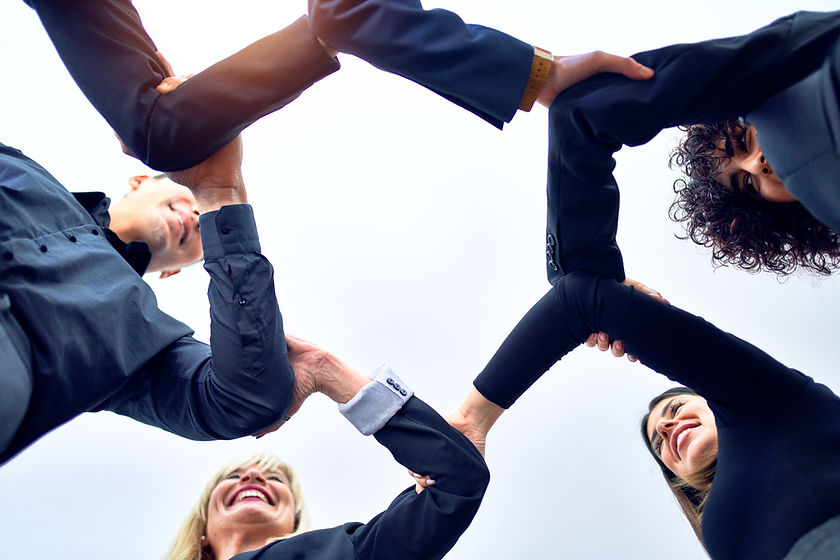 group-business-workers-standing-with-hands-together-office.jpg