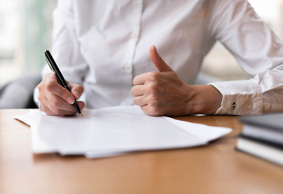 woman-writing-showing-thumbs-up.jpg