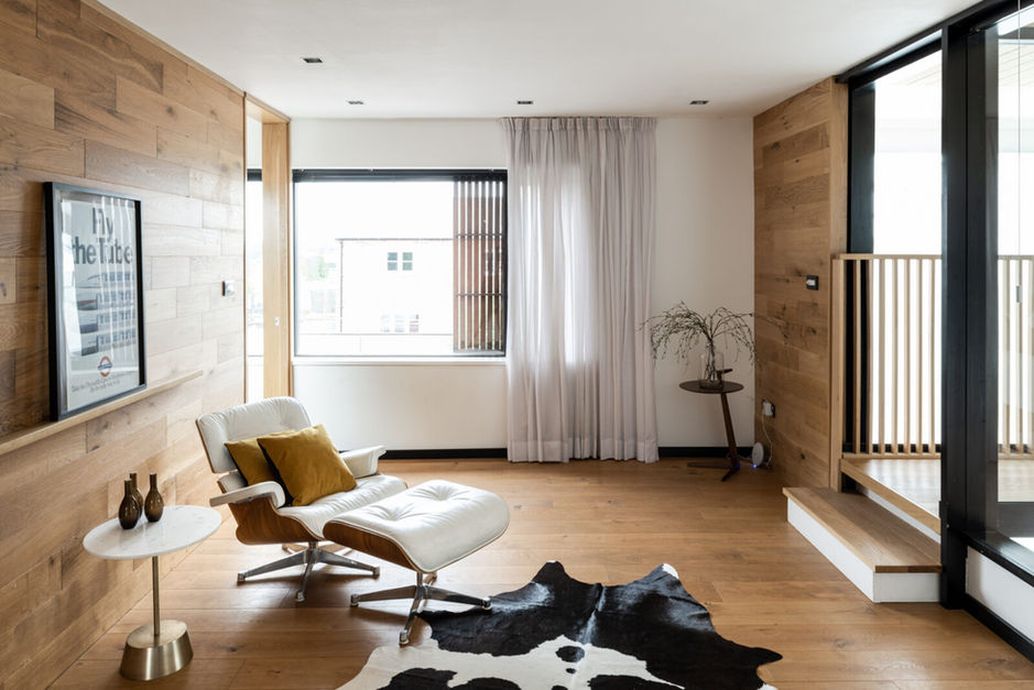 modern bedroom space with eames chair and modern fineline glazing