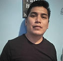 A man smiles at the camera
