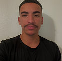 A man smiles at the camera