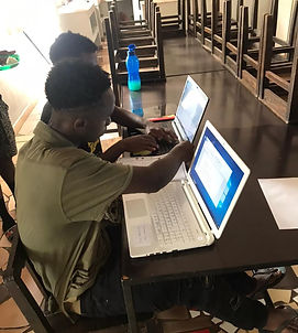 Boys using donated computers for CVs.jpeg