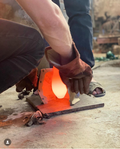 Thumbnail: La Soufflerie - Vase Tete Blue being forged - available from Iris Lifestyle Cambridge UK