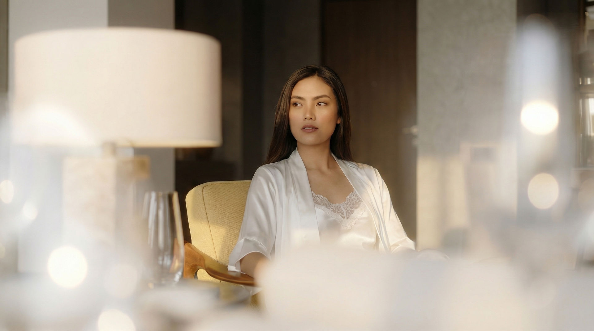 Every detail here — from the light to the hand on the table — was generated, not filmed.
