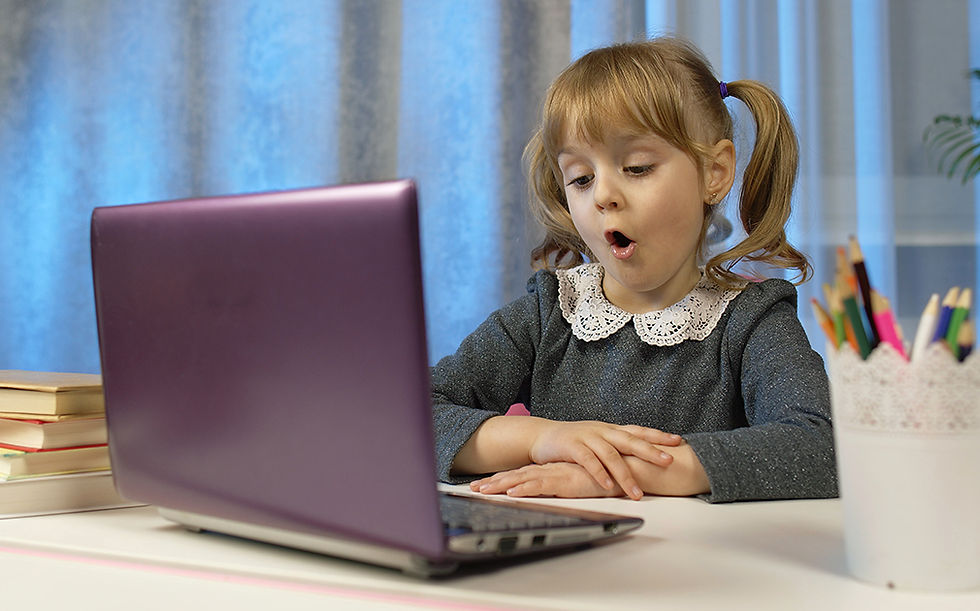 A student using voice dictation on a laptop to bypass handwriting challenges.