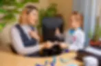 A teacher working one-on-one with a student with dyslexia.