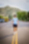 blue shirt hat walking street.jpg