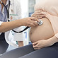 doctor-using-stethoscope-on-pregnant-patients-stomach-595348651-59932a7968e1a2001113f56d.j